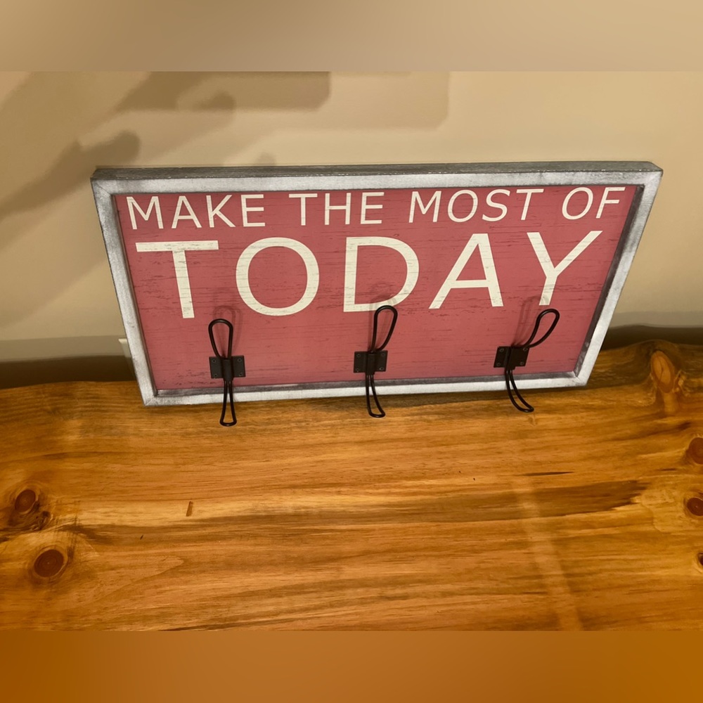 Super cute 3-hook wall mounted coat rack.